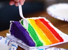 A slice of cake with multicoloured layers like the Pride flag