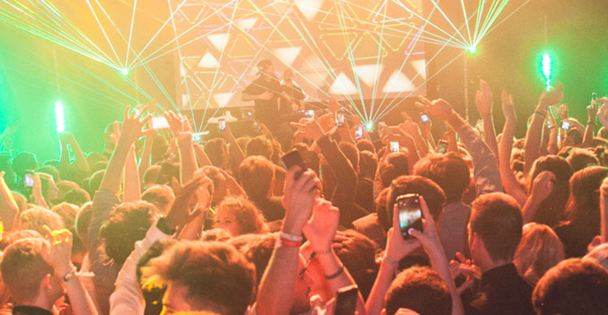 Photograph of a crowd dancing at a nightclub
