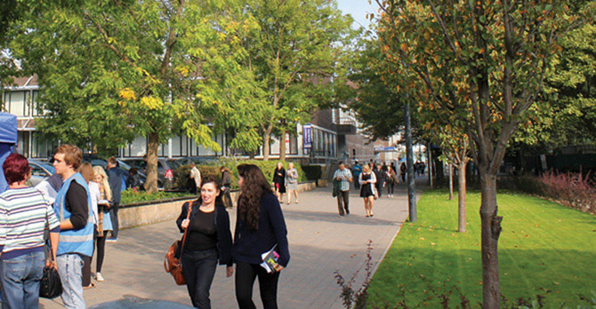 Prospective students walking through campus during an open day.