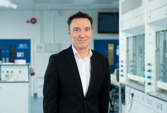 A photograph of Professor Andy Cooper in a laboratory setting