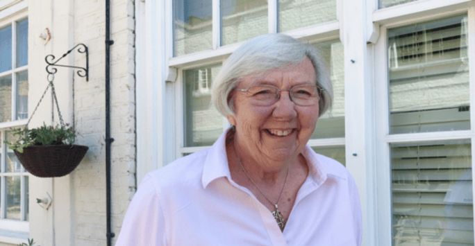 a picture of Averil Mansfield in her garden