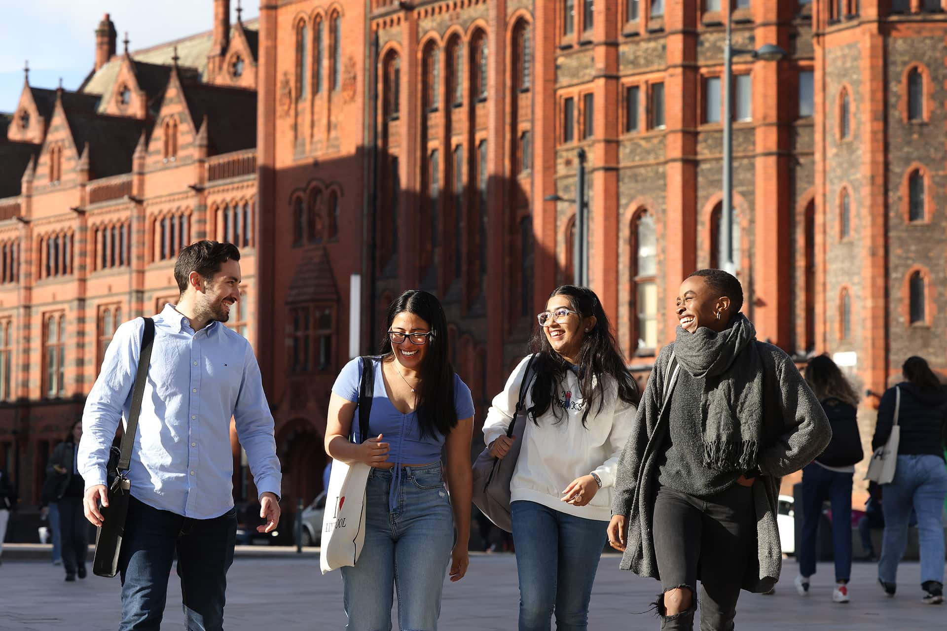 Group of students walking in front of Victoria building