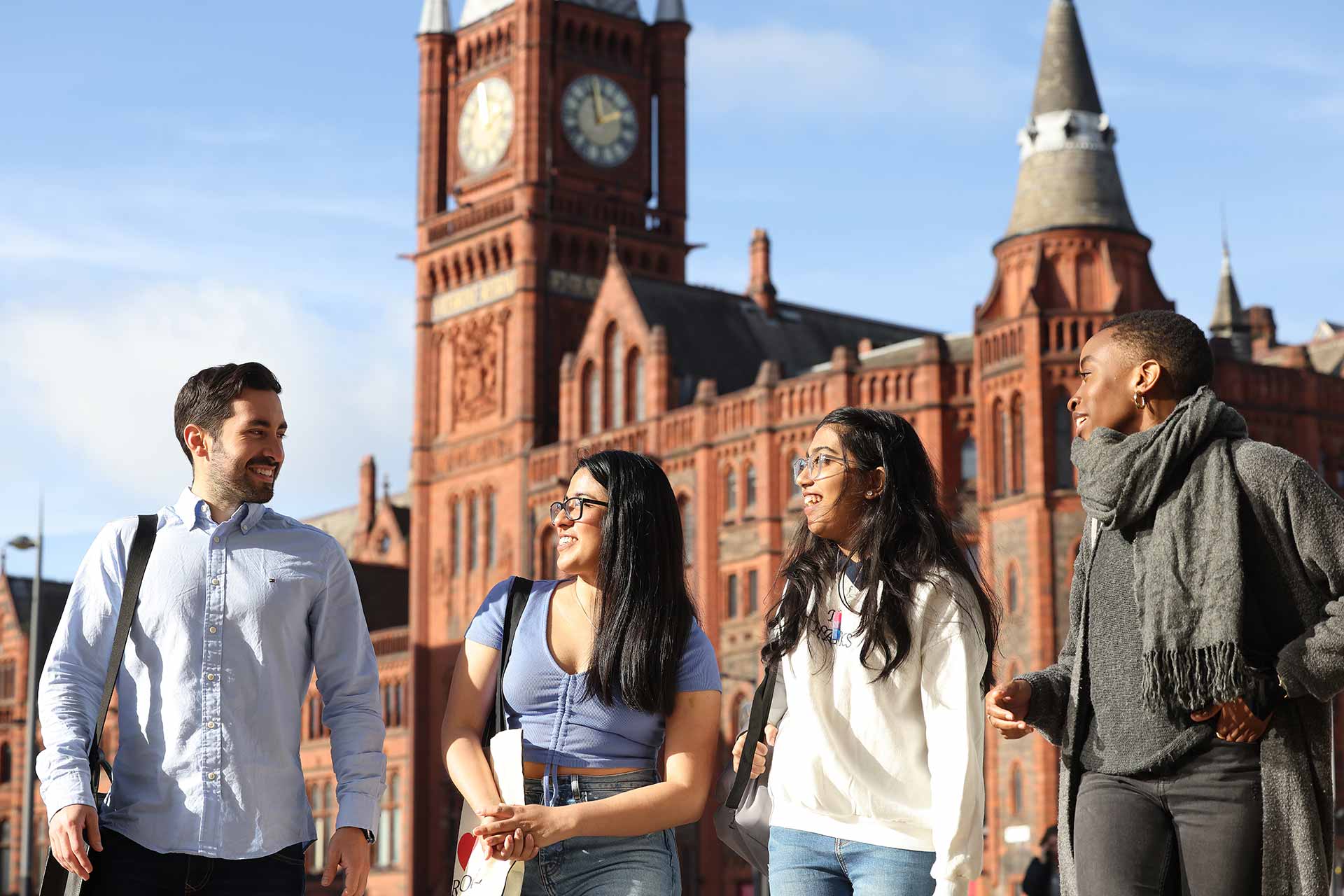 Four students in University Square, outside the Victoria Gallery and Museum.