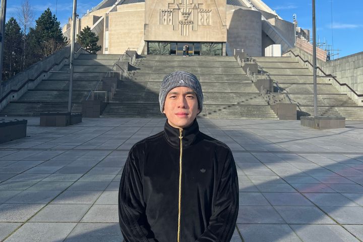 Student standing in front of cathedral