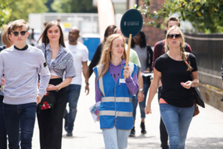 A student volunteering on an open day.