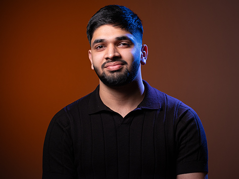 Image of a male student smiling.
