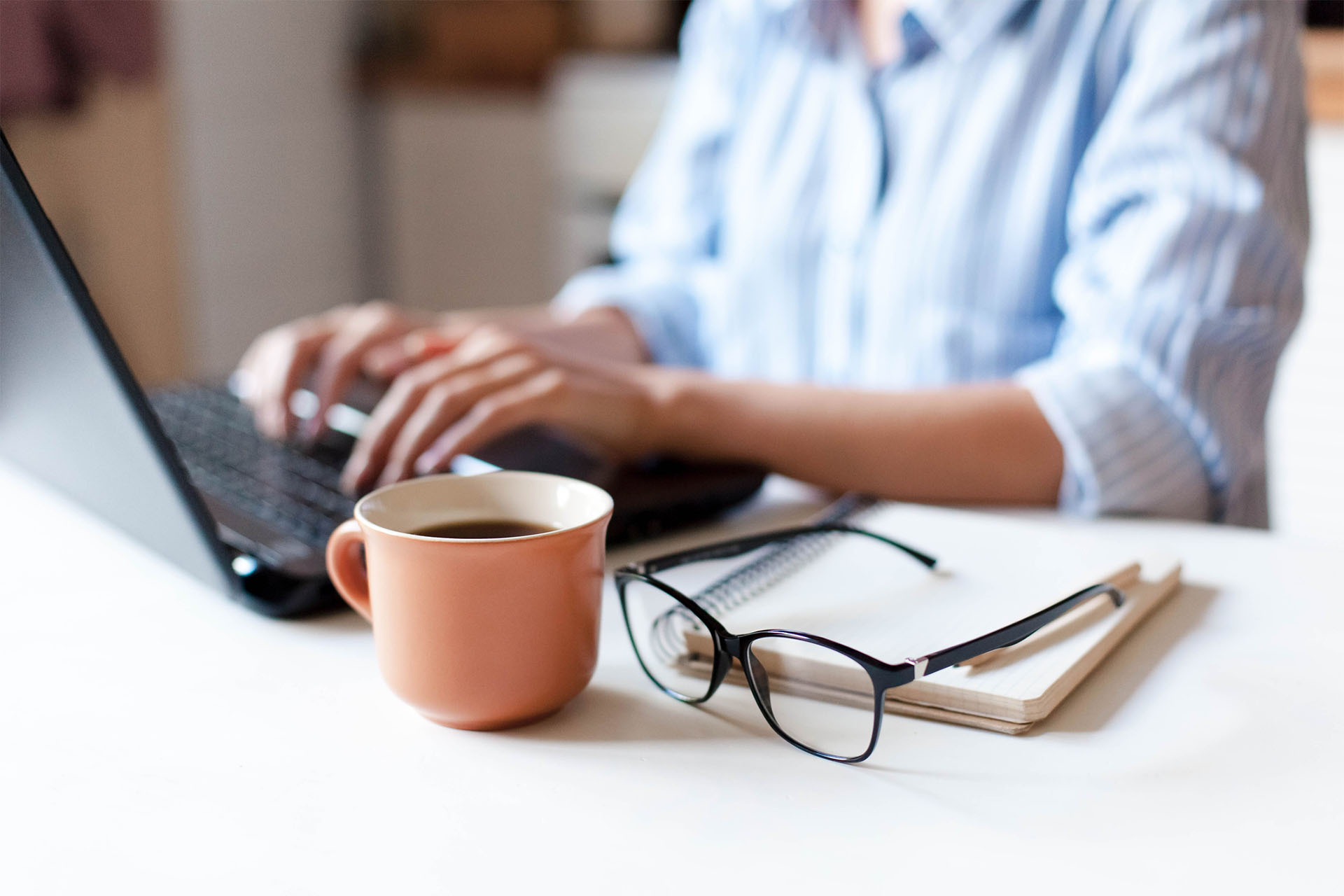 Woman using a laptop at home