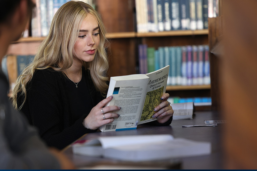 Student reading book