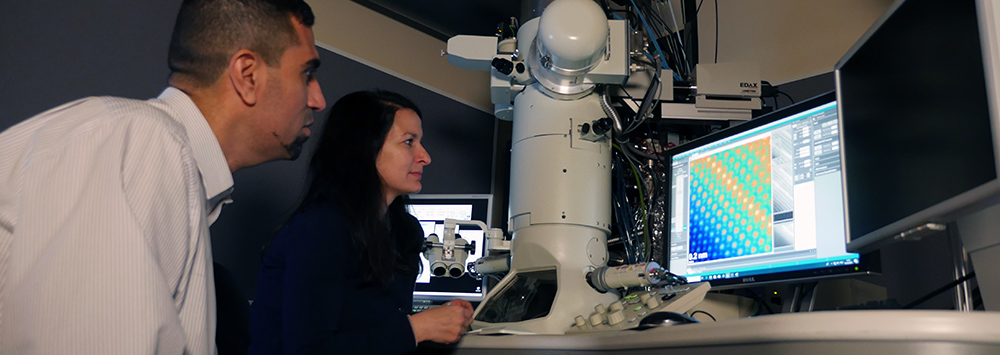 Two scientists working at the Albert Crewe Centre