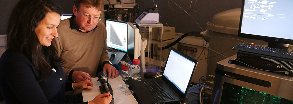 Two scientists working at the Albert Crewe Centre