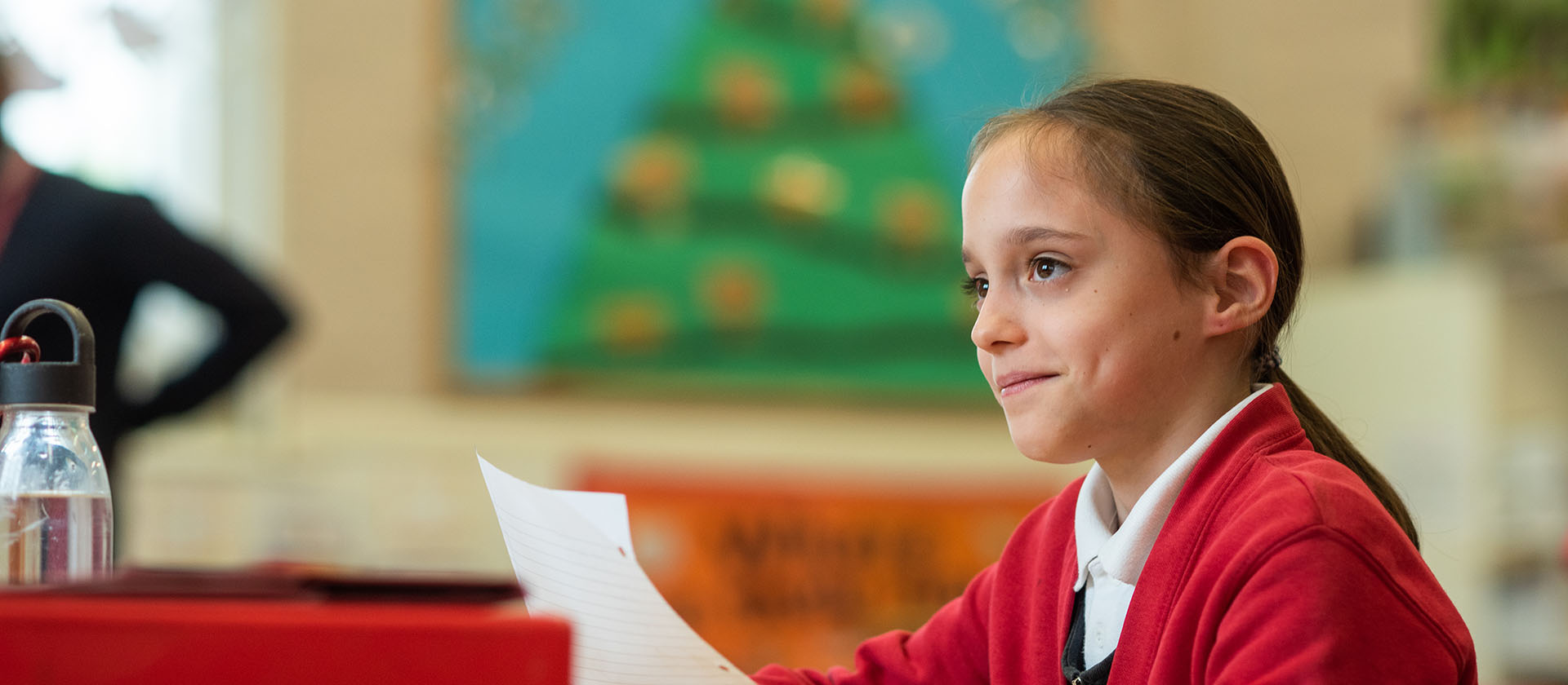 child sitting at a desk