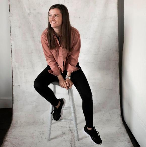 woman sitting on a stool