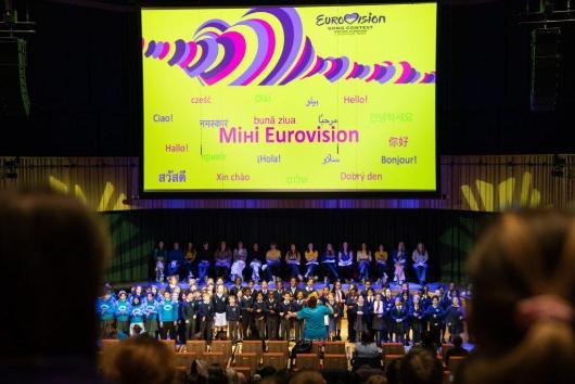 large group of school children on a stage