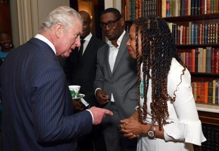 man meeting a line of people at an event