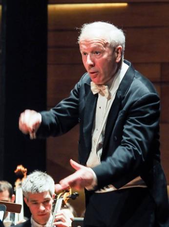 man conducting an orchestra