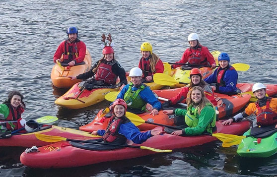 Canoe club members kayaking