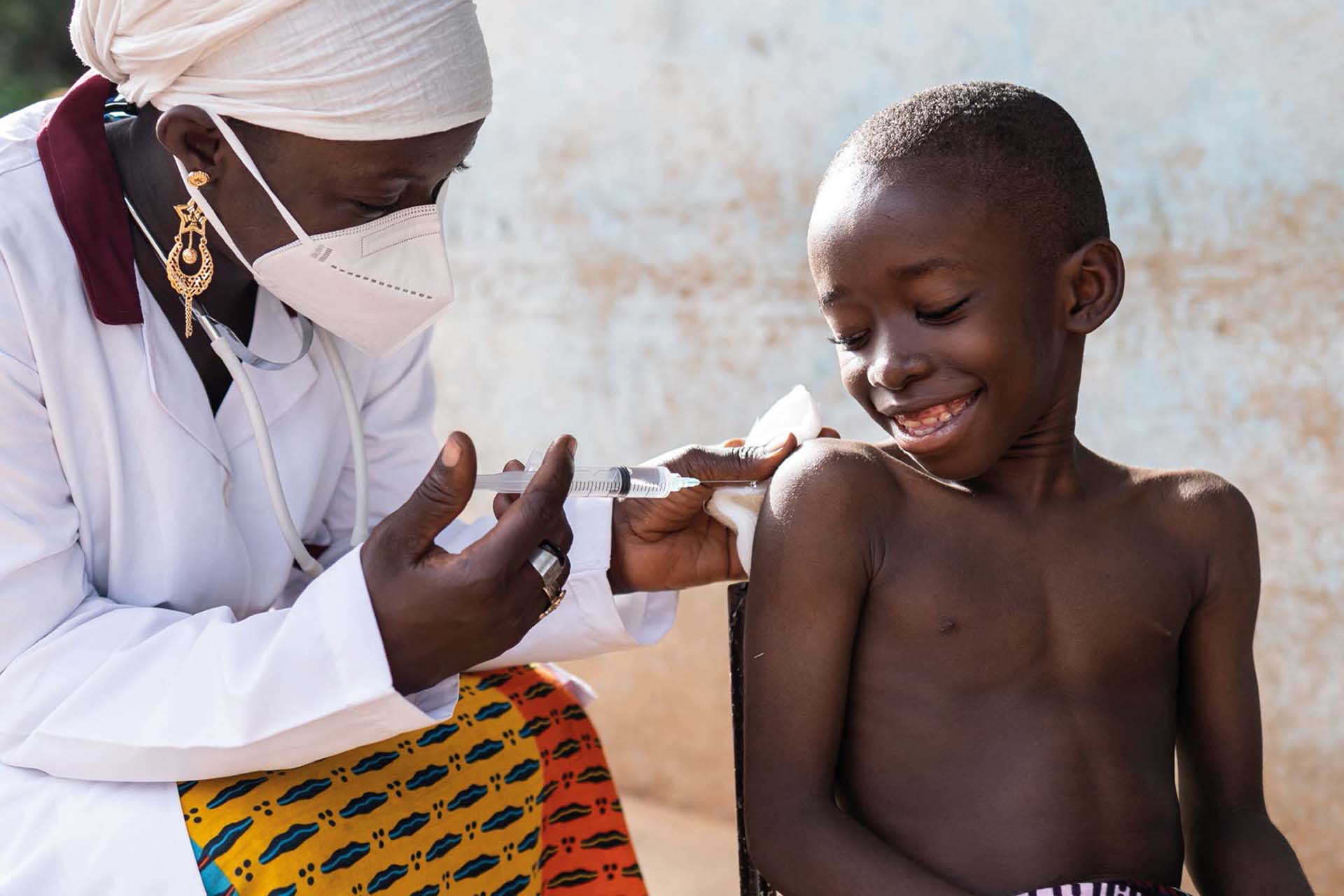 Medical professional administers medicine to a child