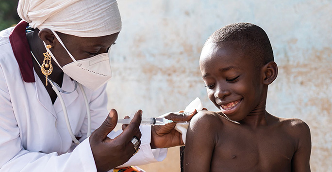 Medical professional administers medicine to a child
