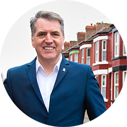 Steve Rotheram pictured on a street in Liverpool