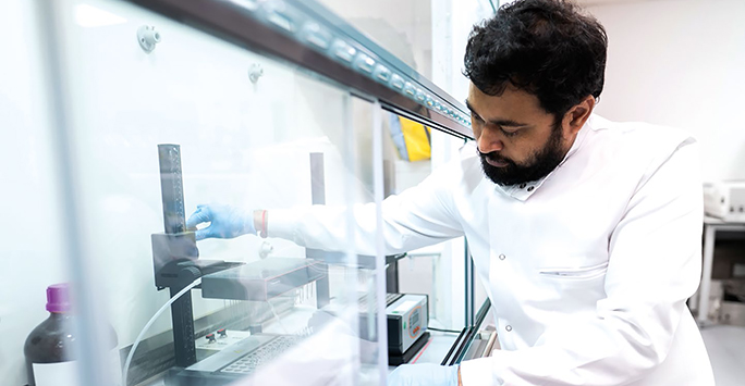 Scientist carries out test in a lab