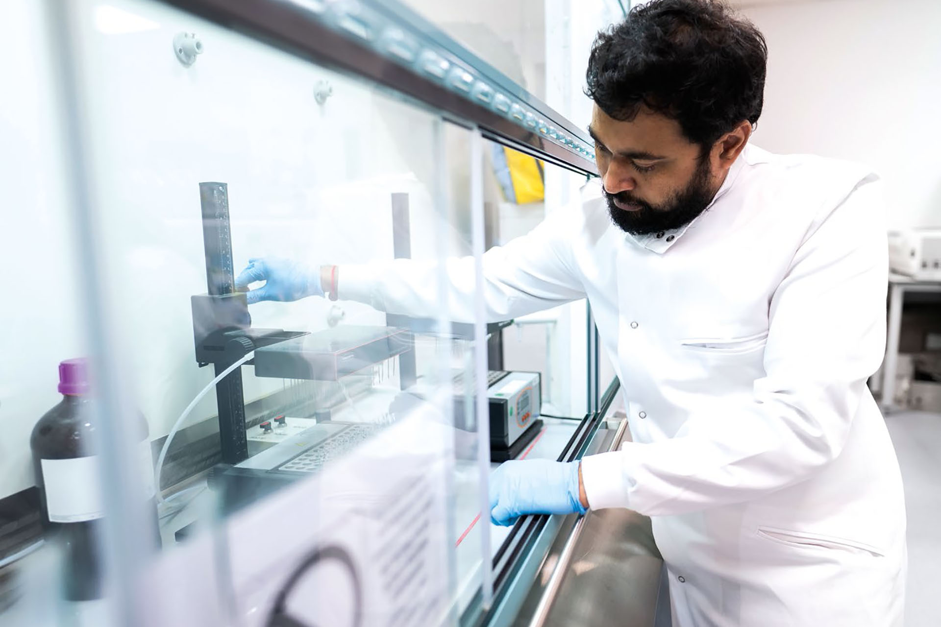 Scientist carries out test in a lab