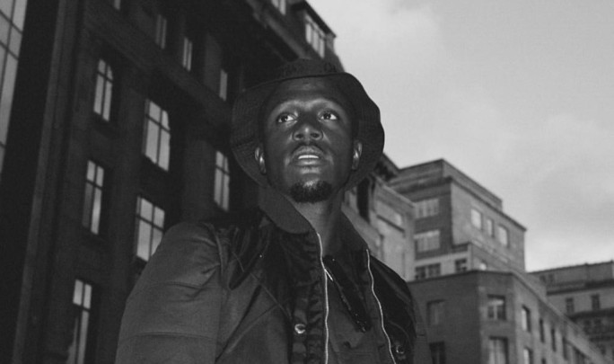 B&W photo of man wearing jacket and hat