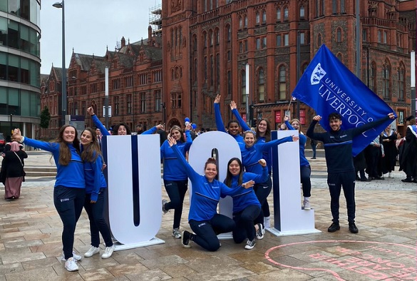 The Handball Team in front of the red brick Victoria Building