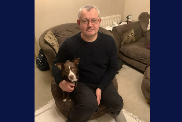 Graduate Michael Dixon and his rescue dog Nellie