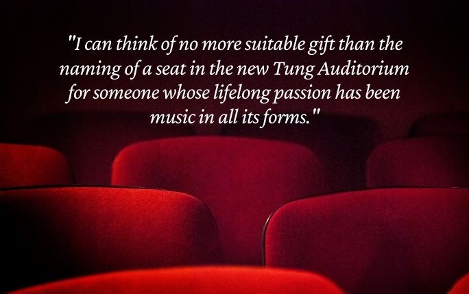 Quote in front of red theatre-style chairs reads: 