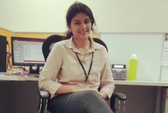 Student sitting on a chair smiling