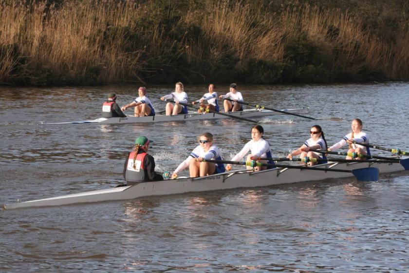 Two rowing boats with students