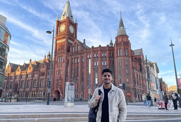 Student Mustafa standing in front of the Victoria Gallery and Museum