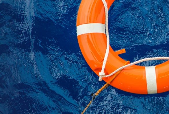 Orange lifebouy in water