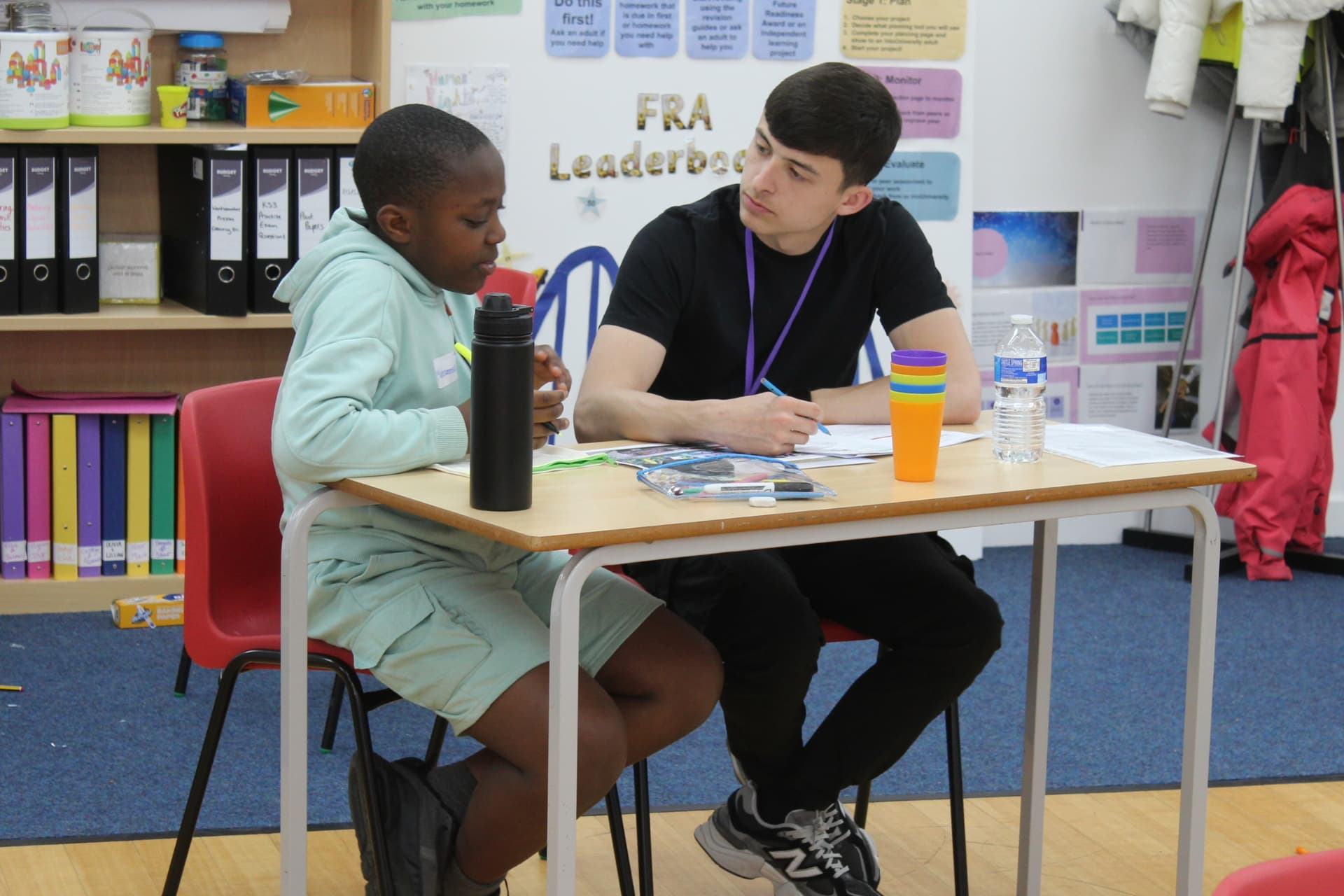 Two people sitting at a desk