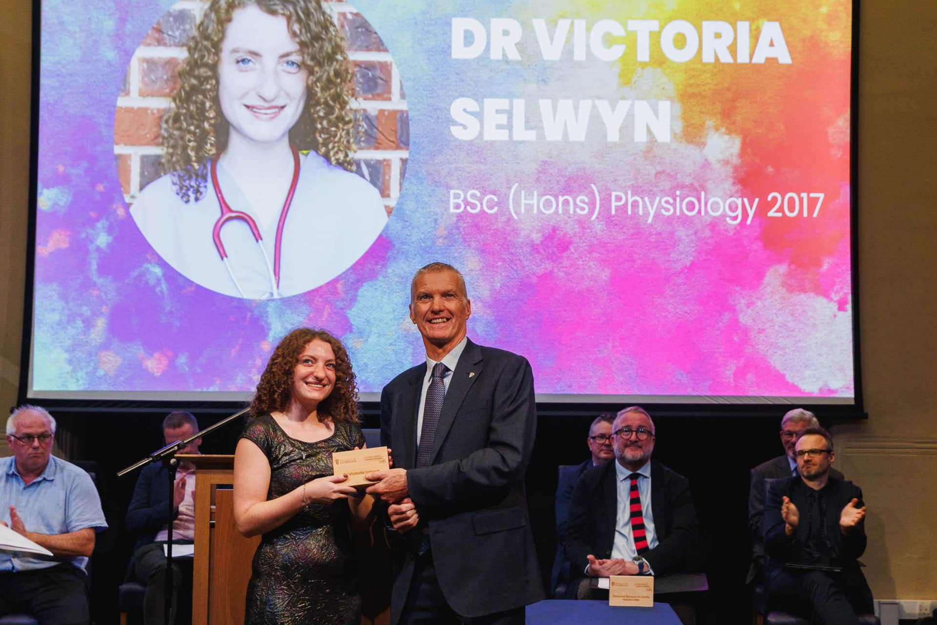 Image of person accepting an award