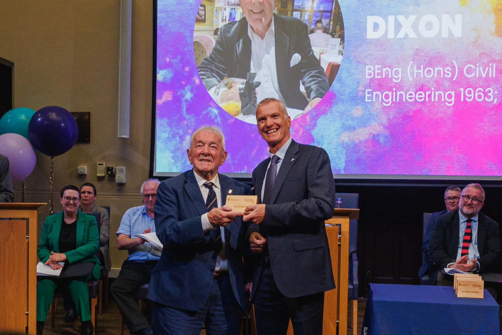 Image of person accepting an award