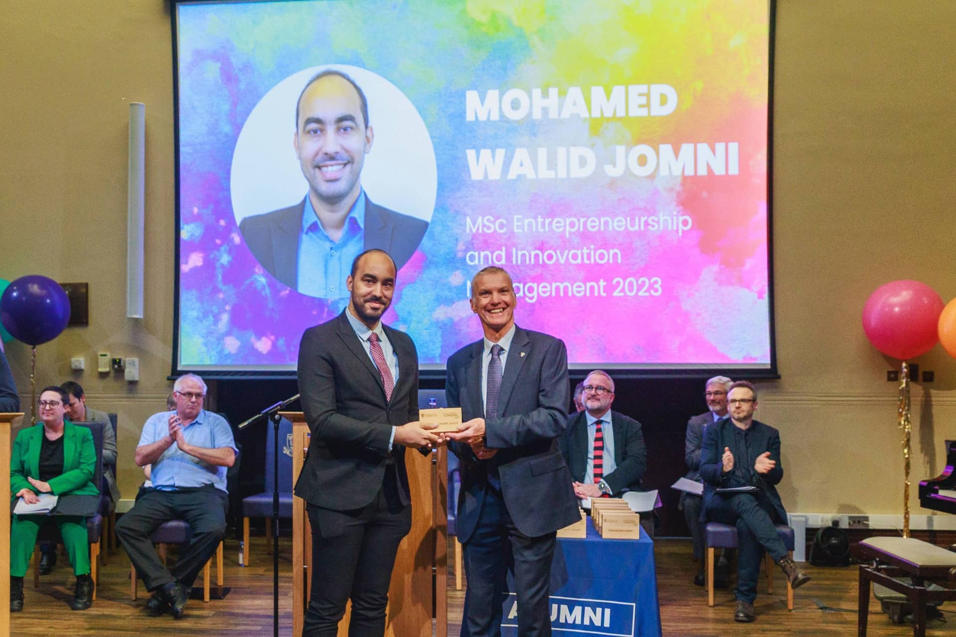 Image of person accepting an award