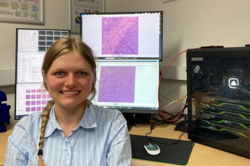 Image of person in front of a computer