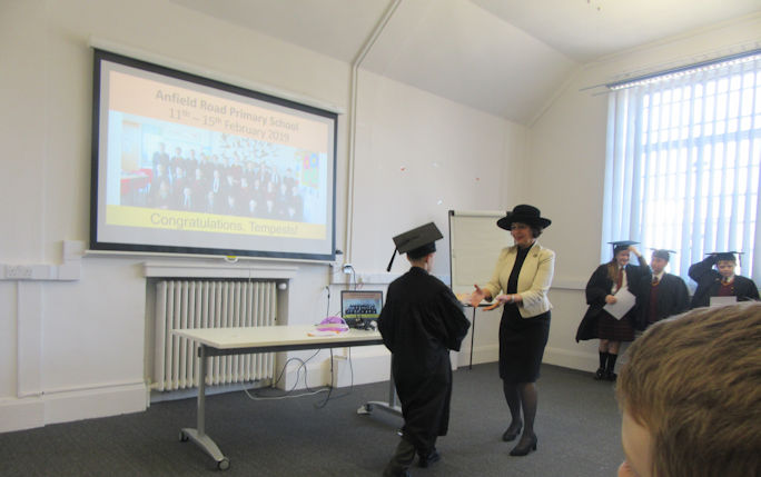 IntoUniversity graduation Abi presenting certificates