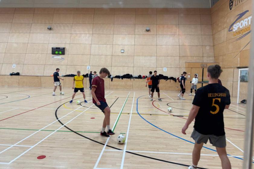 A group of students playing futsal