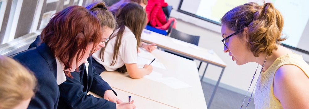 Teacher with students in class