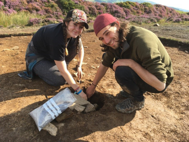 1st years Katie and Adam excavating a posthole for the door of a prehistoric house