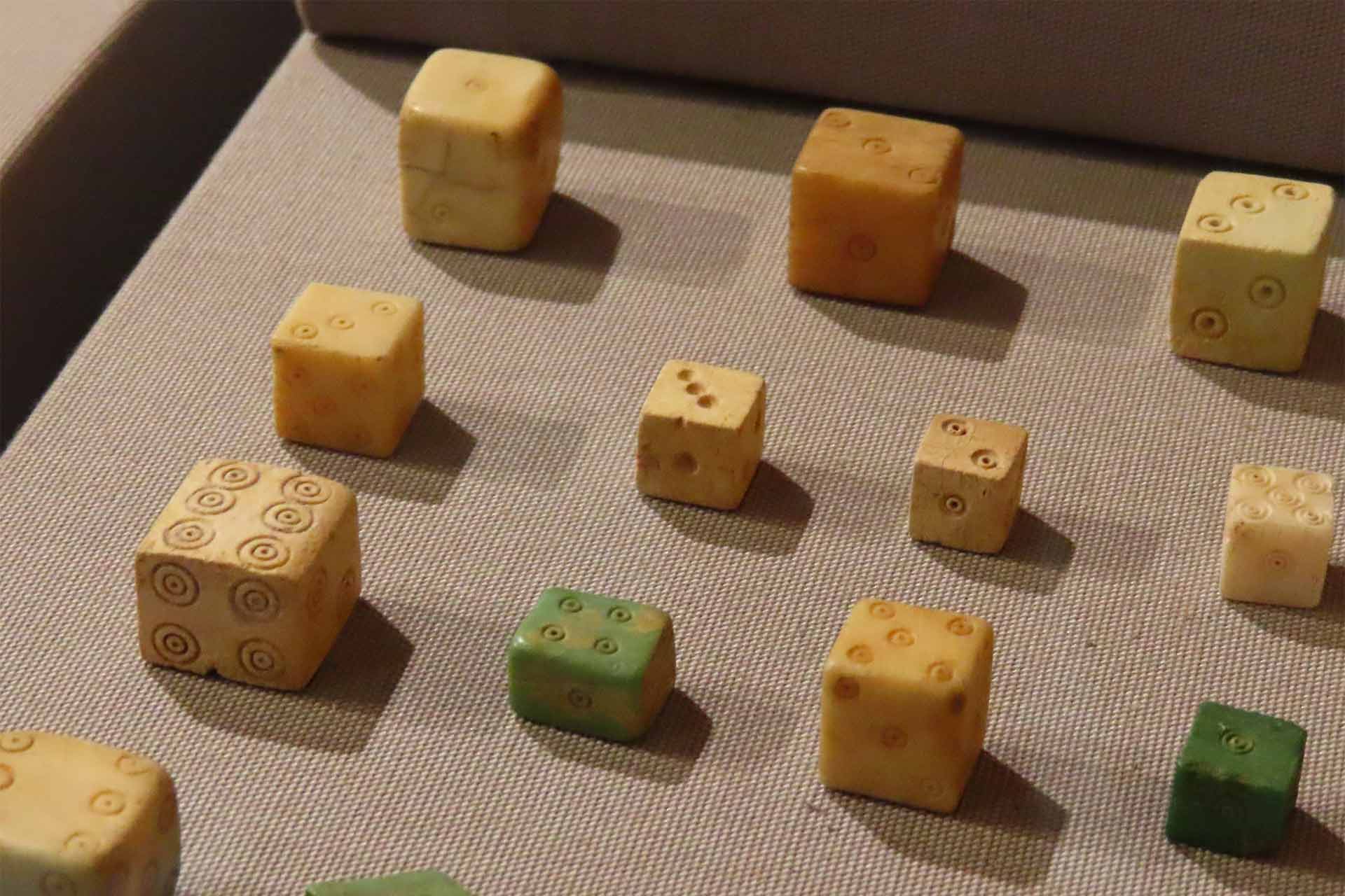 Old handcrafted square toys reminiscent of modern day dice.