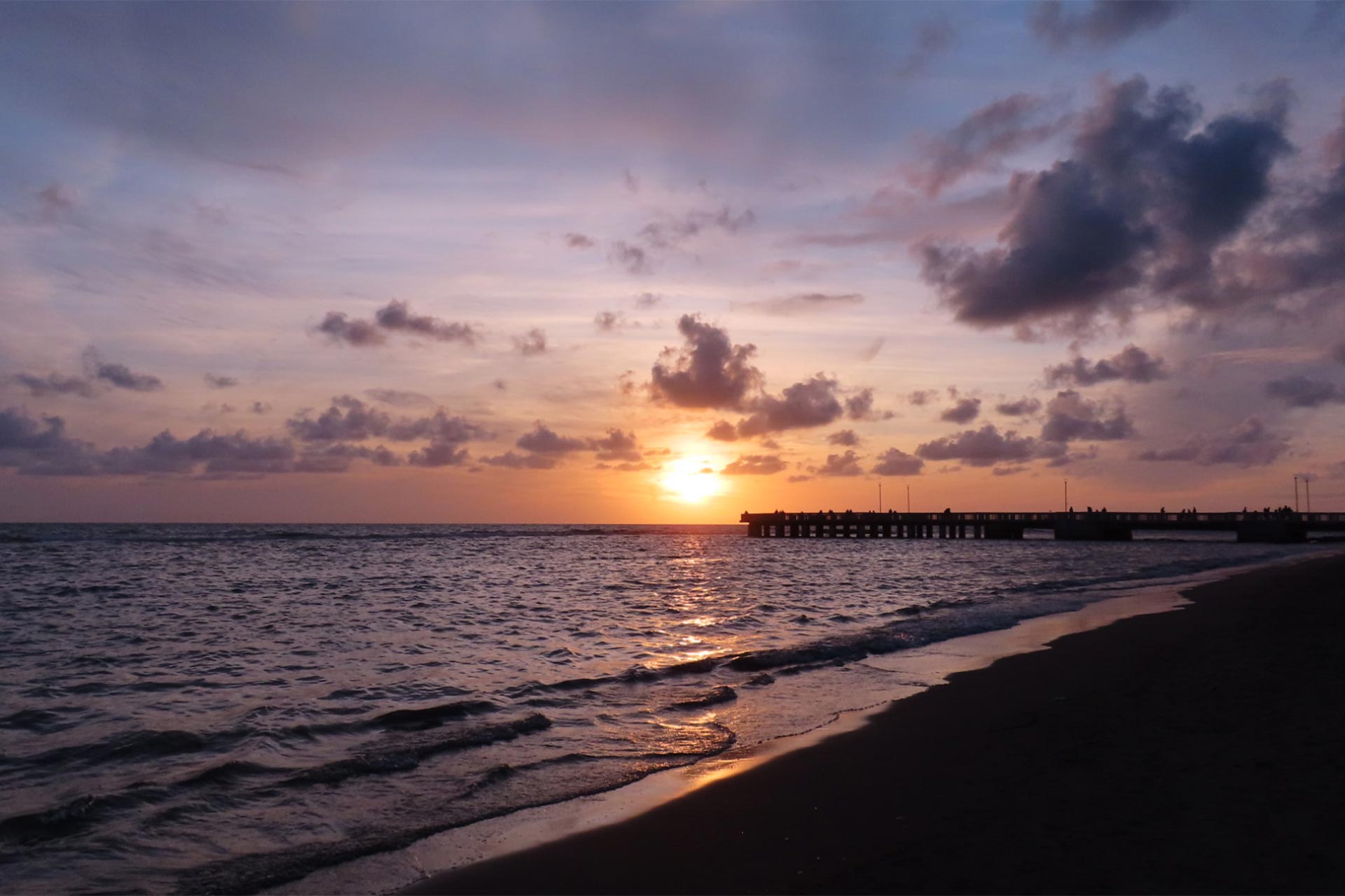 A sunset over a body of water