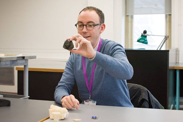 Man showing artefacts