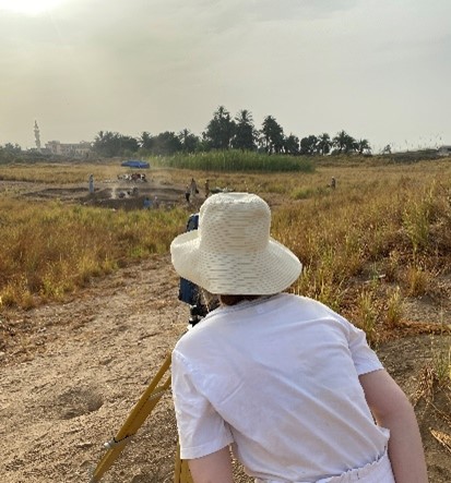 Liz using the total station for survey.