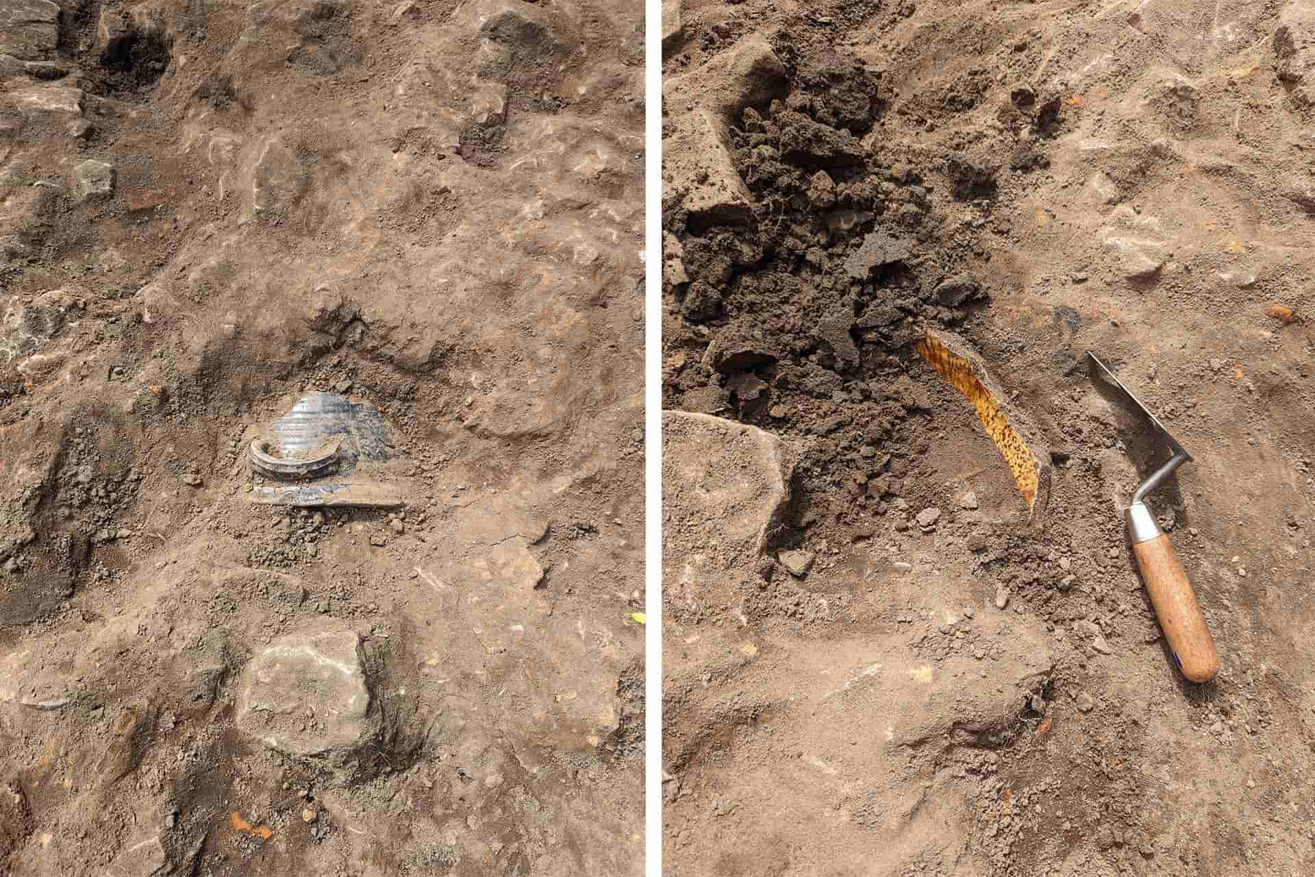 On the left is a metal bowl like object with a handle appearing out of the ground partially excavated, on the right hand side is an archaeological instrument and a type of clay object partially revealed.