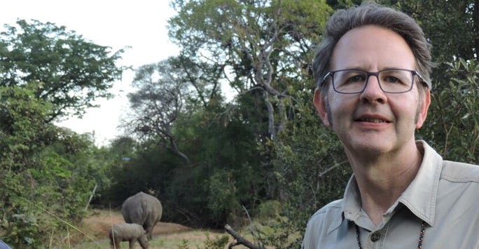 Man in African landscape