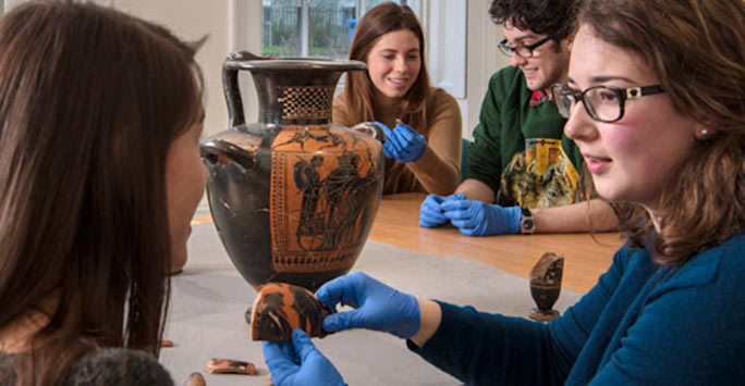 Students looking at artefacts