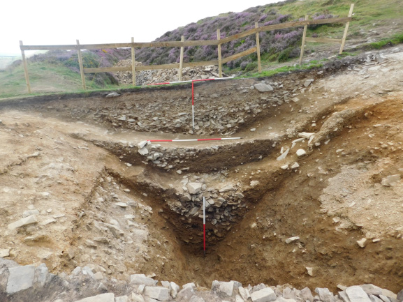 Excavation of the hillfort ditch showing primary fill